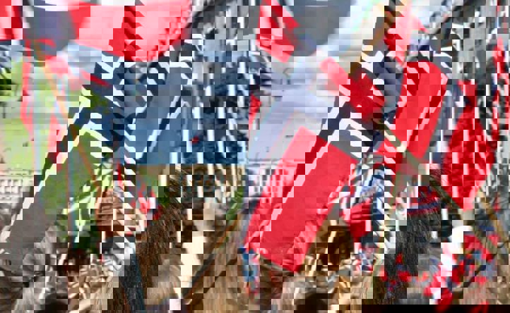 Barn som holder norske flagg og går mot slottet